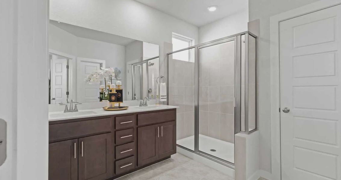 Representative furnished interior of a home built from the Avril by Chesmar Homes in Stream Waters, Buda (Image 23).