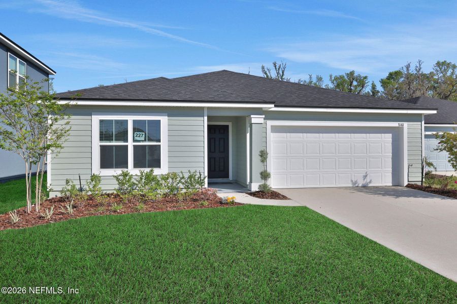 Front exterior of a new home in Wilford Oaks, Orange Park, FL, highlighting curb appeal (Image 23).