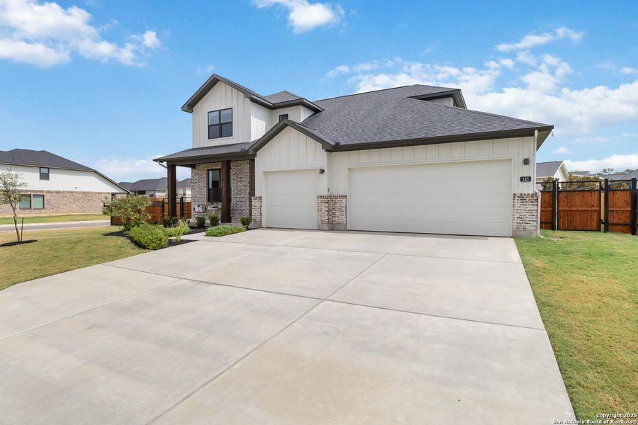 Front exterior of a new home in Woodbridge Farms, La Vernia, TX, highlighting curb appeal (Image 24).