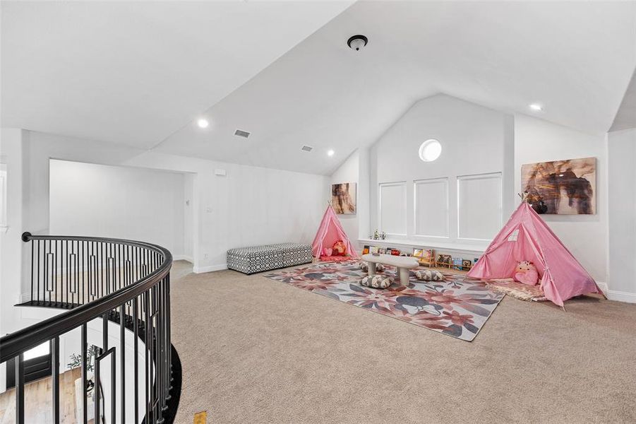Rec room featuring carpet floors, visible vents, recessed lighting, and lofted ceiling