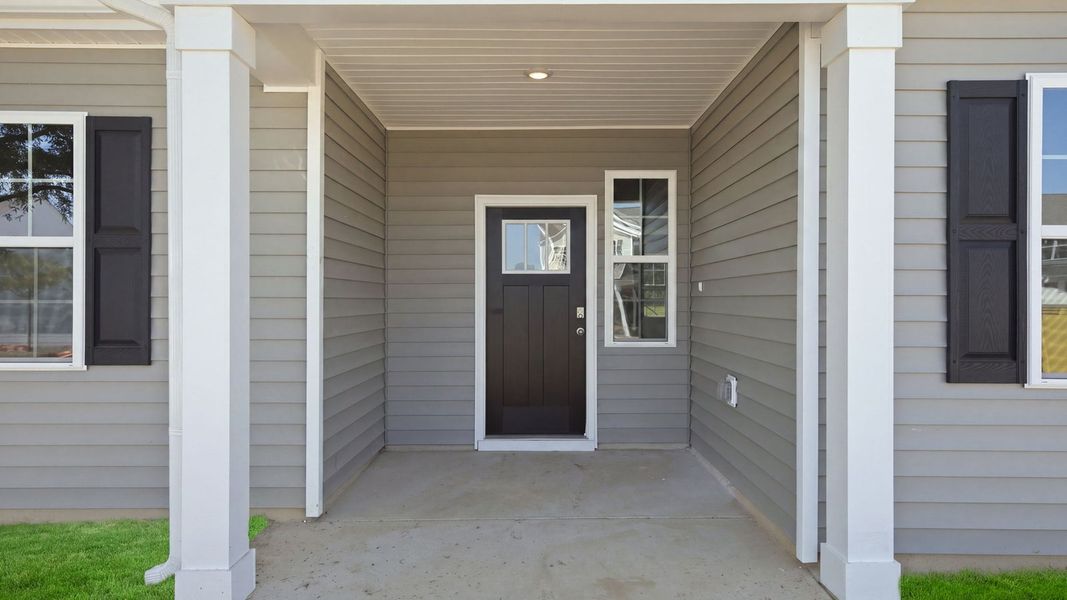 Exterior details and patio area of a home in Tyler - Home on the Lake, New Bern (Image 3).