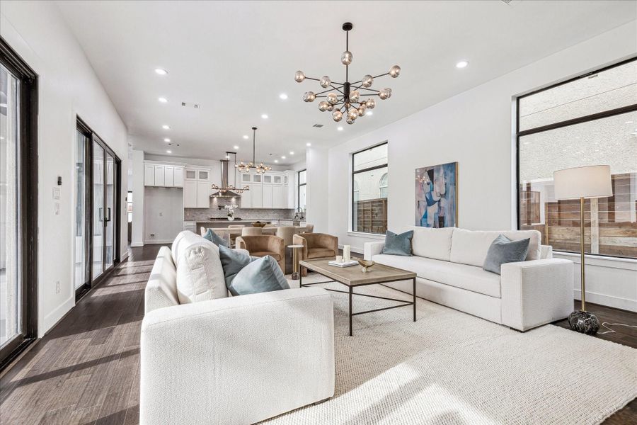 This angle showcases the living room’s seamless connection to the dining and kitchen areas, emphasizing an open, flowing layout ideal for entertaining.