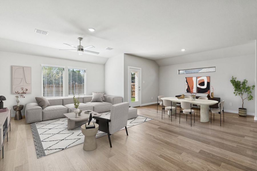 Dining and Living Room in the Heisman home plan by Trophy Signature Homes – REPRESENTATIVE PHOTO Dining and Living Room in the Heisman home plan by Trophy Signature Homes – REPRESENTATIVE PHOTO