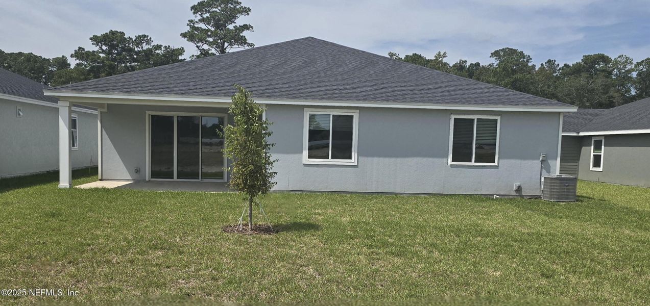 Front exterior of a new home in Azalea Creek, Jacksonville, FL, highlighting curb appeal (Image 21).