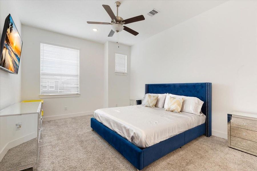 Furnished interior view inside a new home in Meridiana, Iowa Colony (Image 5).