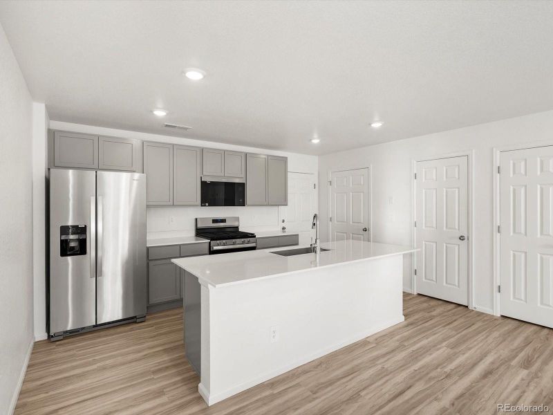 Furnished interior view inside a new home in Skyview at High Point, Aurora (Image 12).