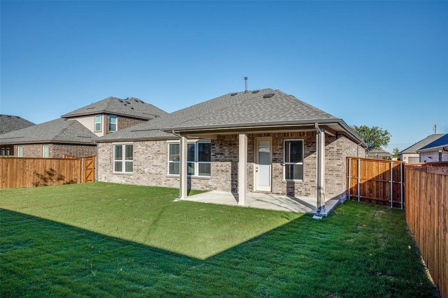 Exterior details and patio area of a home in The Preserve Estates, Justin (Image 3).