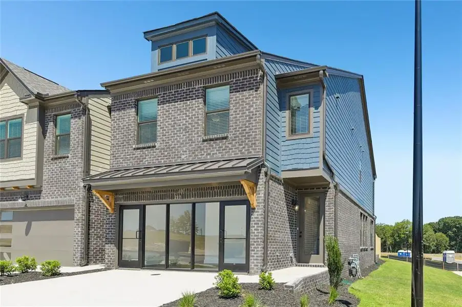 Front exterior of a new home in Tribute, Hoschton, GA, highlighting curb appeal (Image 2). Front exterior of a new home in Tribute, Hoschton, GA, highlighting curb appeal (Image 2).