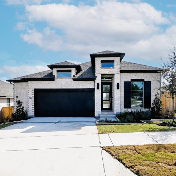 Front exterior of a new home in La Cima 50', San Marcos, TX, highlighting curb appeal (Image 23). Front exterior of a new home in La Cima 50', San Marcos, TX, highlighting curb appeal (Image 23).