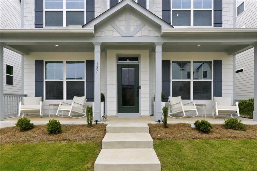 Exterior details and patio area of a home in Marble Tree, Ball Ground (Image 25).
