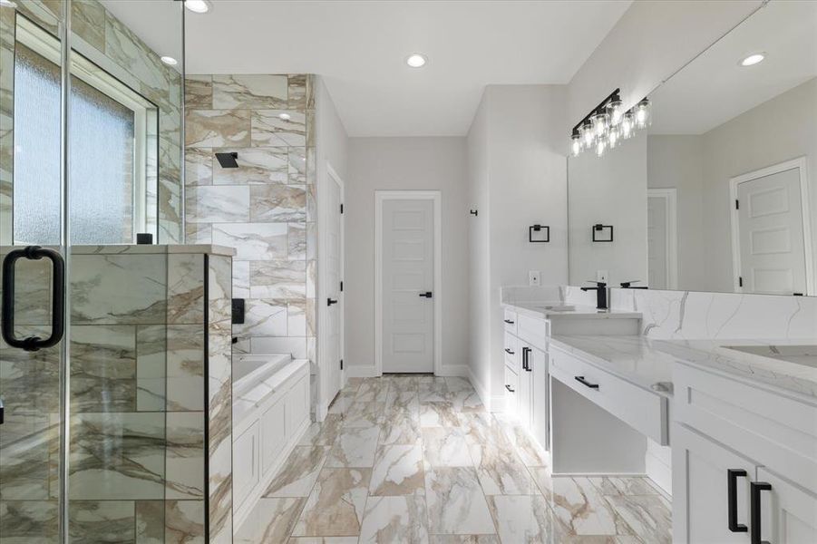 Bathroom featuring recessed lighting, a sink, marble finish floor, a bath, and a stall shower