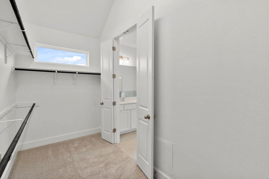 Walk-in closet in Primary Bedroom Walk-in closet in Primary Bedroom