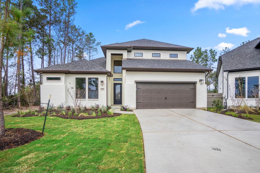 Front exterior of a new home in Artavia, Conroe, TX, highlighting curb appeal (Image 25). Front exterior of a new home in Artavia, Conroe, TX, highlighting curb appeal (Image 25).