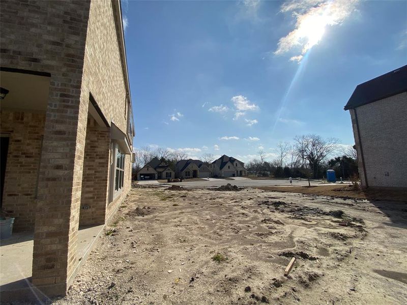 Enormous side yard on this quiet cul-de-sac lot (sod & fence not installed yet.) Fence will extend up towards front of the house and will sit on property line where neighbors grass starts.