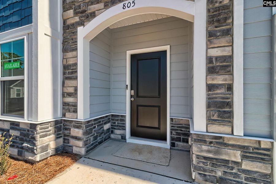 Front exterior of a new home in Cottages at Roofs Pond, West Columbia, SC, highlighting curb appeal (Image 19).