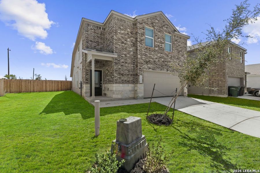 Front exterior of a new home in Stone Garden, San Antonio, TX, highlighting curb appeal (Image 2). Front exterior of a new home in Stone Garden, San Antonio, TX, highlighting curb appeal (Image 2).
