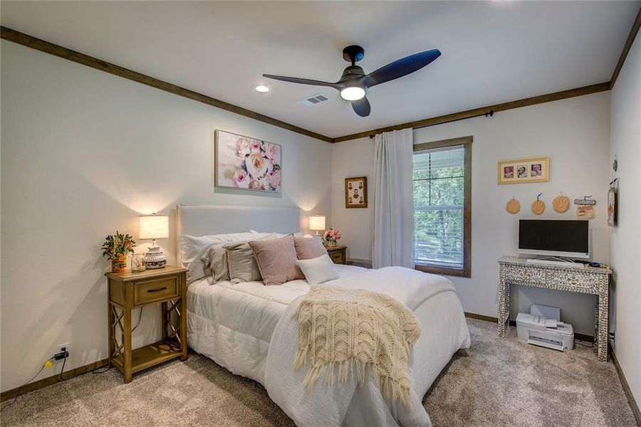 split bedroom plan. Bedroom 2 with carpet , crown molding, a ceiling fan, and recessed lighting