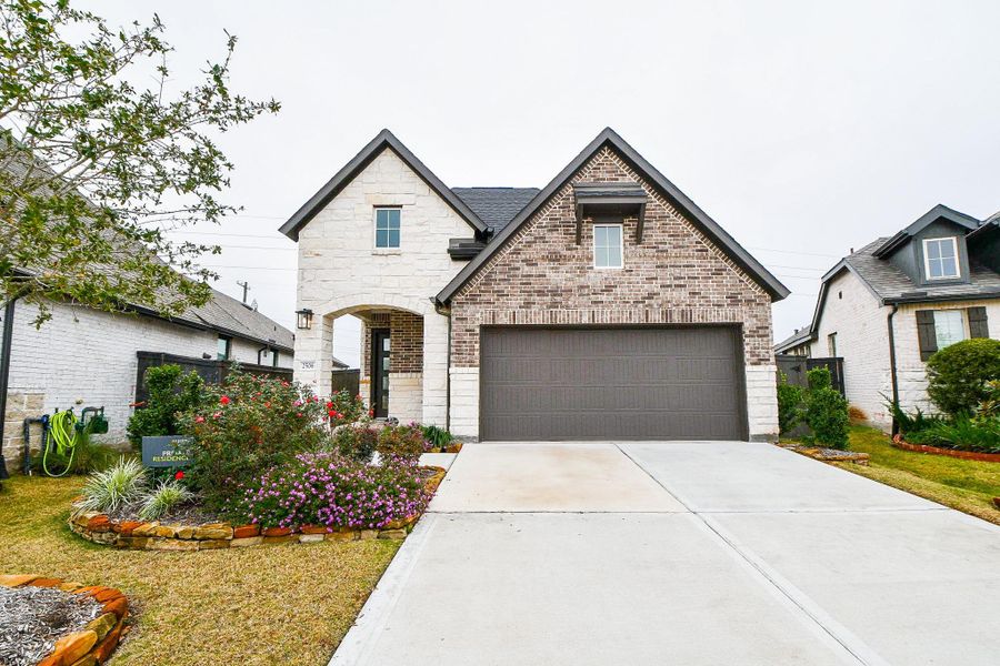 Front exterior of a new home in , Richmond, TX, highlighting curb appeal (Image 24).