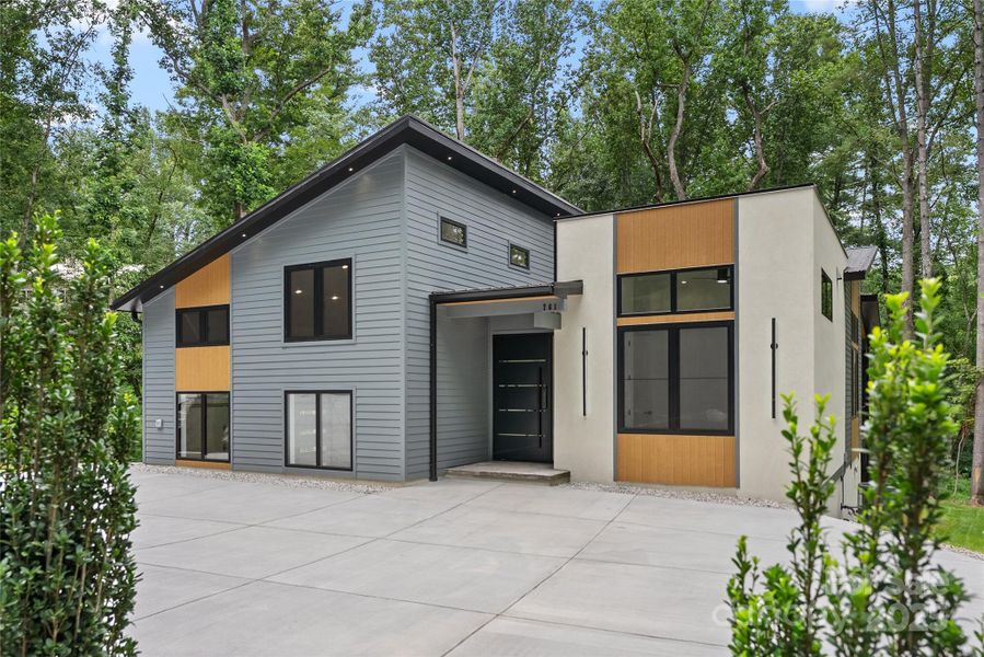 Front exterior of a new home in , Arden, NC, highlighting curb appeal (Image 2).