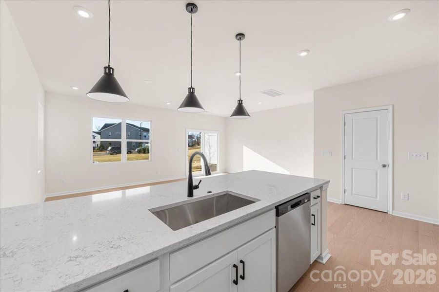 GE Stainless Appliances and Large Stainless Sink.