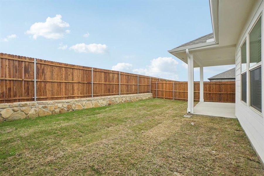 Exterior details and patio area of a home in Parks at Foster Crossing - Spring Series, Anna (Image 25).