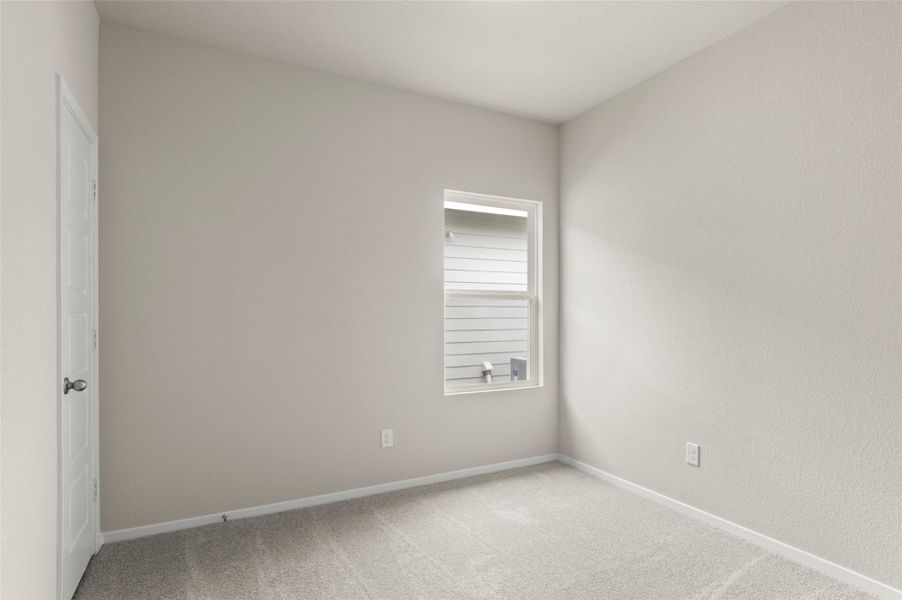 Unfurnished room with light colored carpet