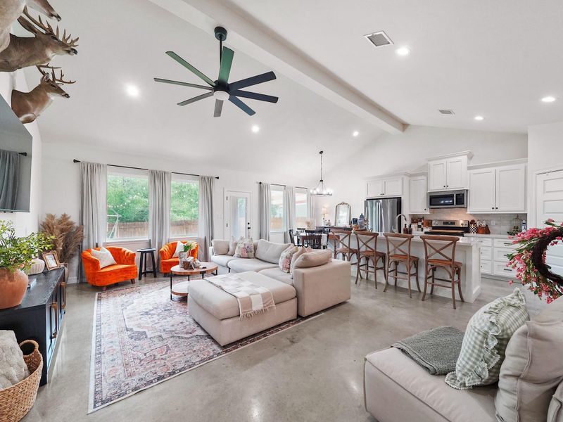 GORGEOUS VIEW OF THE OPEN CONCEPT KITCHEN AND LIVING ROOM