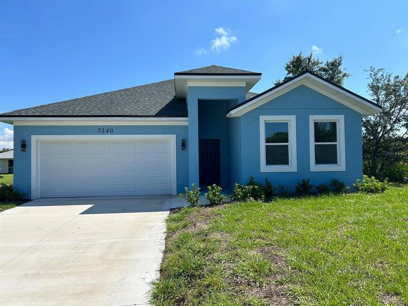 Front exterior of a new home in , Englewood, FL, highlighting curb appeal (Image 2). Front exterior of a new home in , Englewood, FL, highlighting curb appeal (Image 2).