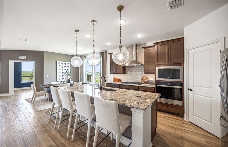 *actual home, furniture not included - Large island overlooking gathering room and dining areas