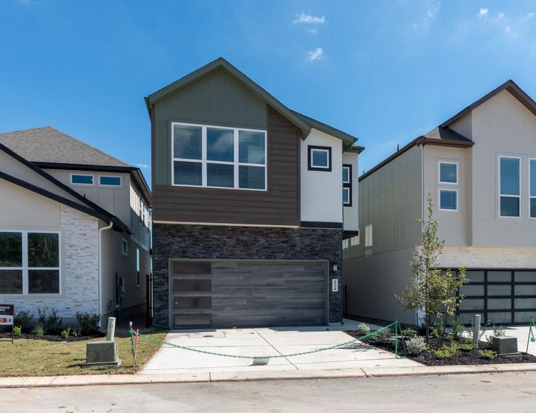 Front exterior of a new home in Centero at Stone Oak, San Antonio, TX, highlighting curb appeal (Image 19).