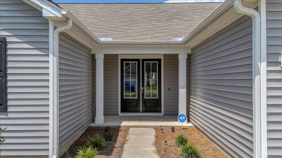 Front exterior of a new home in French Quarter Creek, Huger, SC, highlighting curb appeal (Image 2).