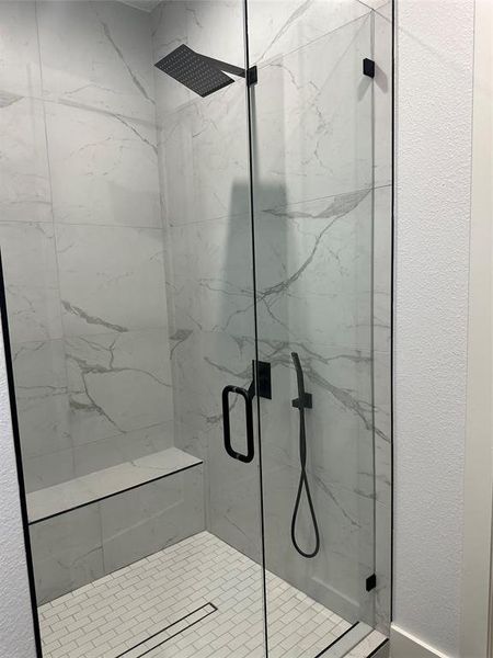 Bathroom with a shower with door