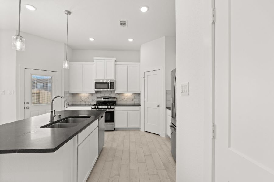 Furnished interior view inside a new home in Meridiana, Manvel (Image 6).