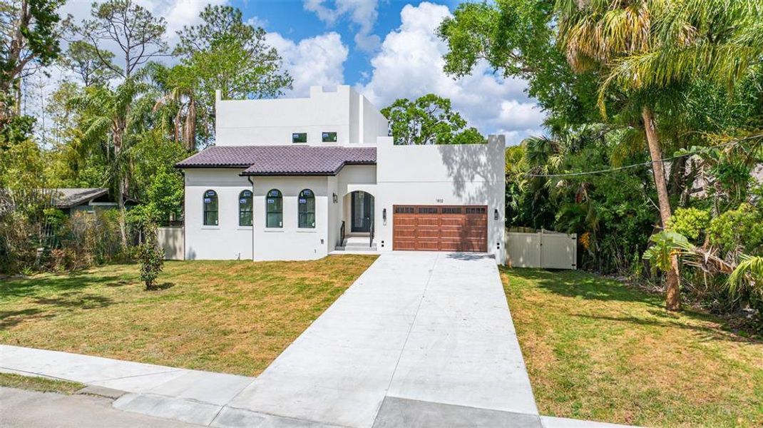 Front exterior of a new home in , Tampa, FL, highlighting curb appeal (Image 25).
