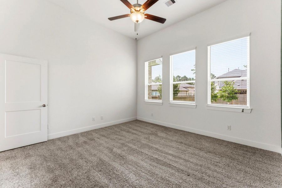 Primary bedroom has windows that provide natural light