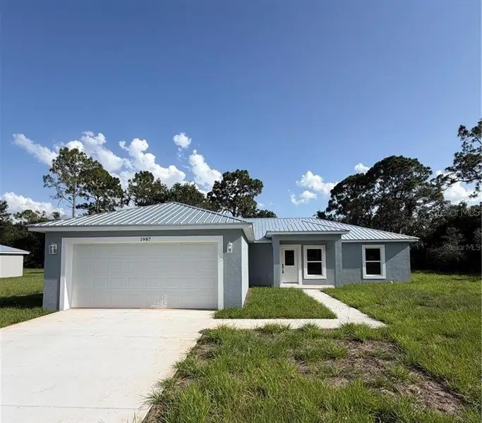 Front exterior of a new home in , Lake Wales, FL, highlighting curb appeal (Image 2). Front exterior of a new home in , Lake Wales, FL, highlighting curb appeal (Image 2).