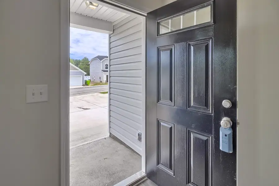 Representative furnished interior of a home built from the Poplar A by McGuinn Homes in Ashton Lakes, Lexington (Image 5).