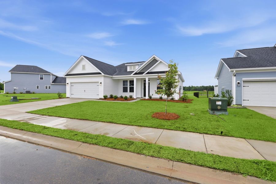 Front exterior of a new home in Edgefield, Loris, SC, highlighting curb appeal (Image 20).