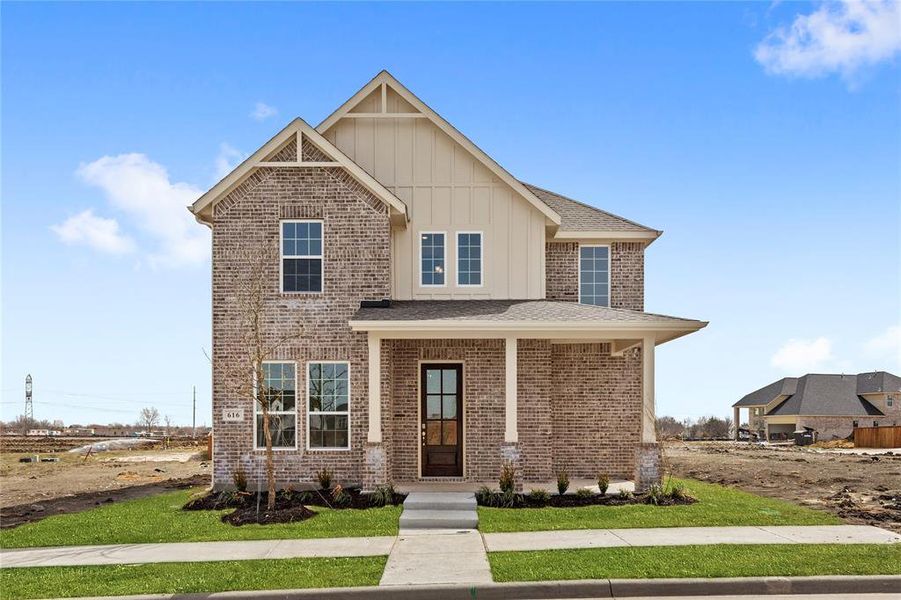 Front exterior of a new home in Edgewater, Fate, TX, highlighting curb appeal (Image 1). Front exterior of a new home in Edgewater, Fate, TX, highlighting curb appeal (Image 1).