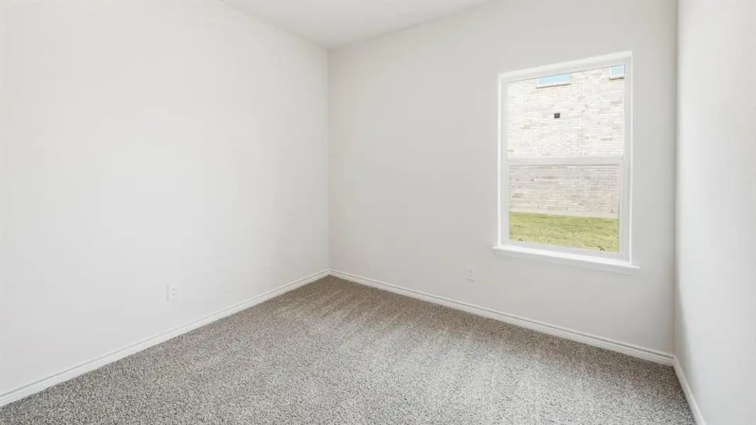 Unfurnished room with light colored carpet and baseboards