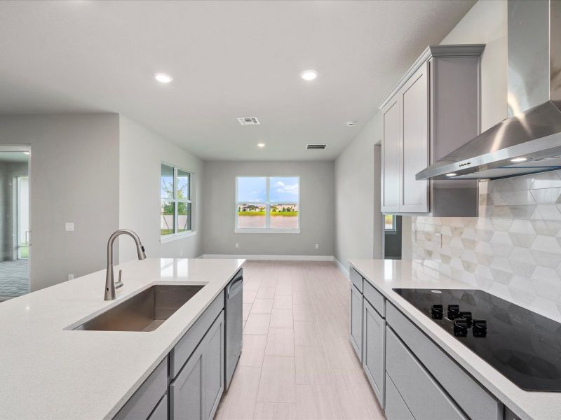 Kitchen in the Coral floorplan at 6326 NW Sweetwood Drive in Brystol at Wylder