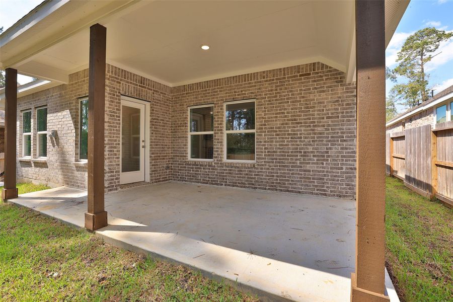 Exterior details and patio area of a home in The Woodlands Hills, Willis (Image 2). Exterior details and patio area of a home in The Woodlands Hills, Willis (Image 2).