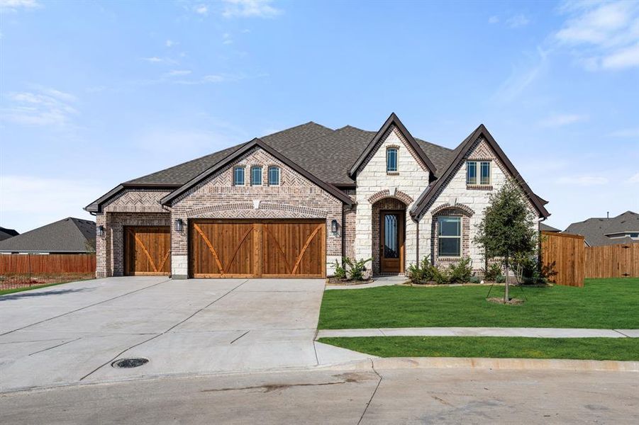 Front exterior of a new home in Stone River Glen 60s, Royse City, TX, highlighting curb appeal (Image 1).