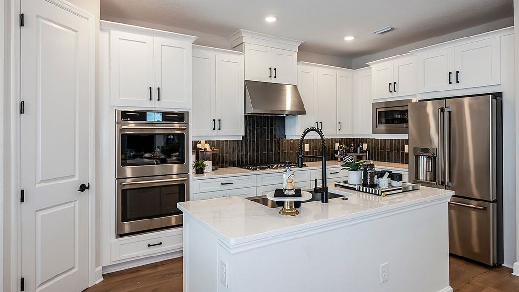 Representative furnished interior of a home built from the Bimini by Taylor Morrison in Ardisia Park, New Smyrna Beach (Image 6).