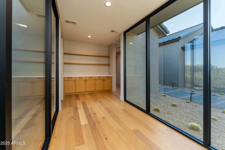 Hallway from garage to key drop Hallway from garage to key drop