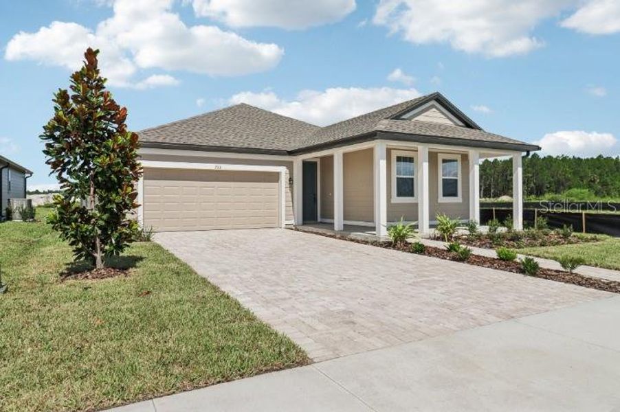 Front exterior of a new home in Ardisia Park, New Smyrna Beach, FL, highlighting curb appeal (Image 21).