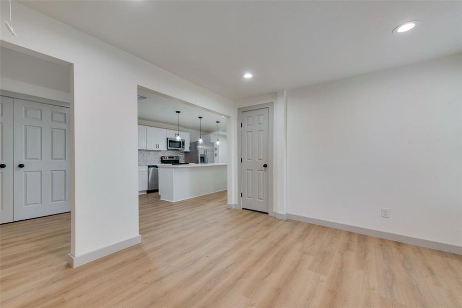 Unfurnished living room with light hardwood / wood-style flooring