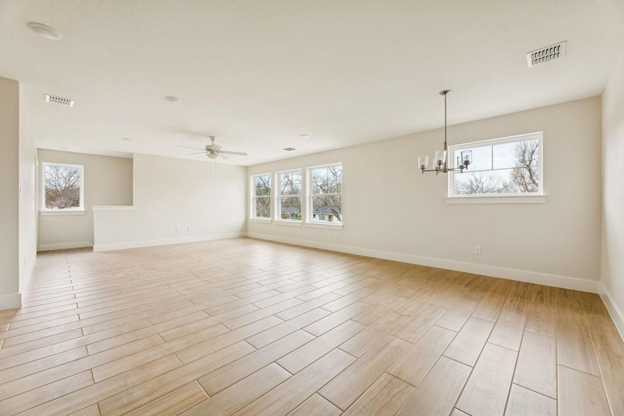 Guest Quarters - view from hallway looking at open space of kitchen, dining, living.