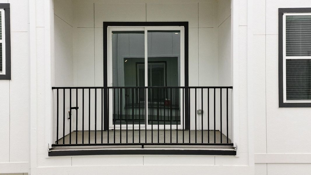 Framed by sliding glass doors, the spacious balcony offers the perfect spot to unwind, enjoy the fresh air, or sip your morning coffee. Ideal for both quiet relaxation and casual gatherings, this outdoor retreat extends the comfort of the home into the open air. Framed by sliding glass doors, the spacious balcony offers the perfect spot to unwind, enjoy the fresh air, or sip your morning coffee. Ideal for both quiet relaxation and casual gatherings, this outdoor retreat extends the comfort of the home into the open air.