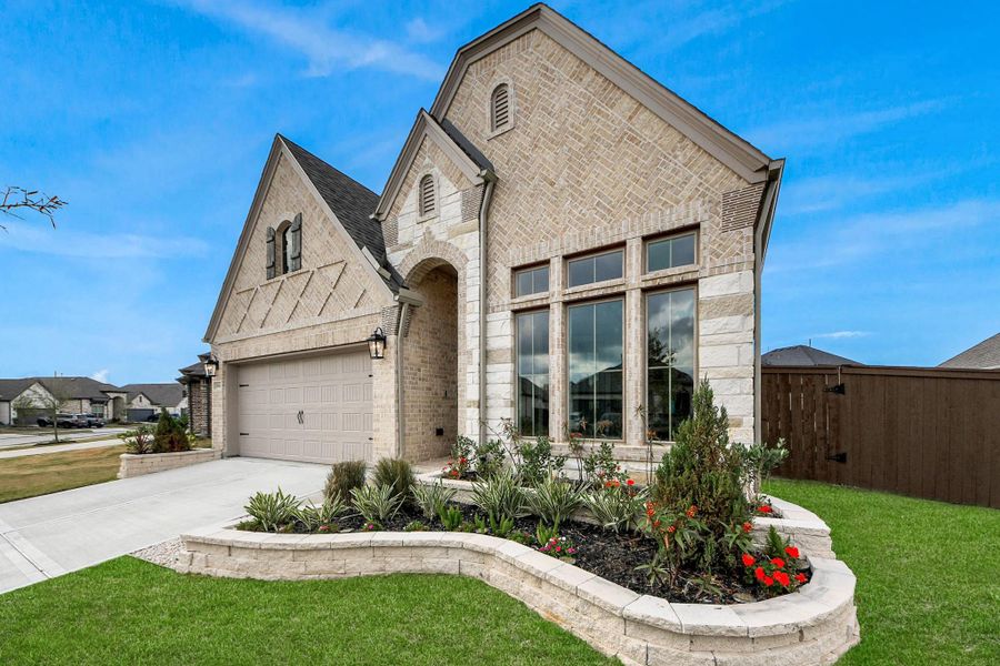 Professionally landscaped front yard offers exceptional curb appeal. Professionally landscaped front yard offers exceptional curb appeal.